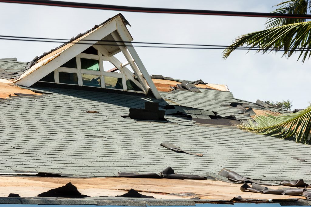 A large building with a damaged roof